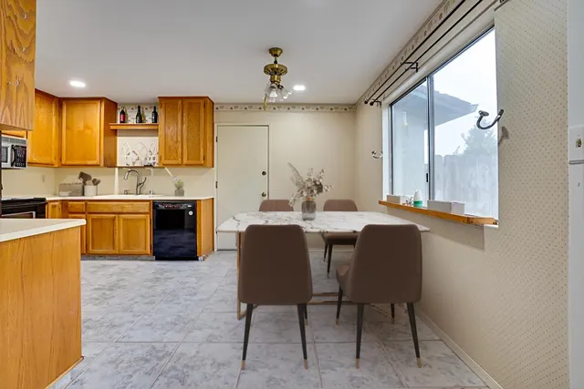 a kitchen with a sink cabinets and window
