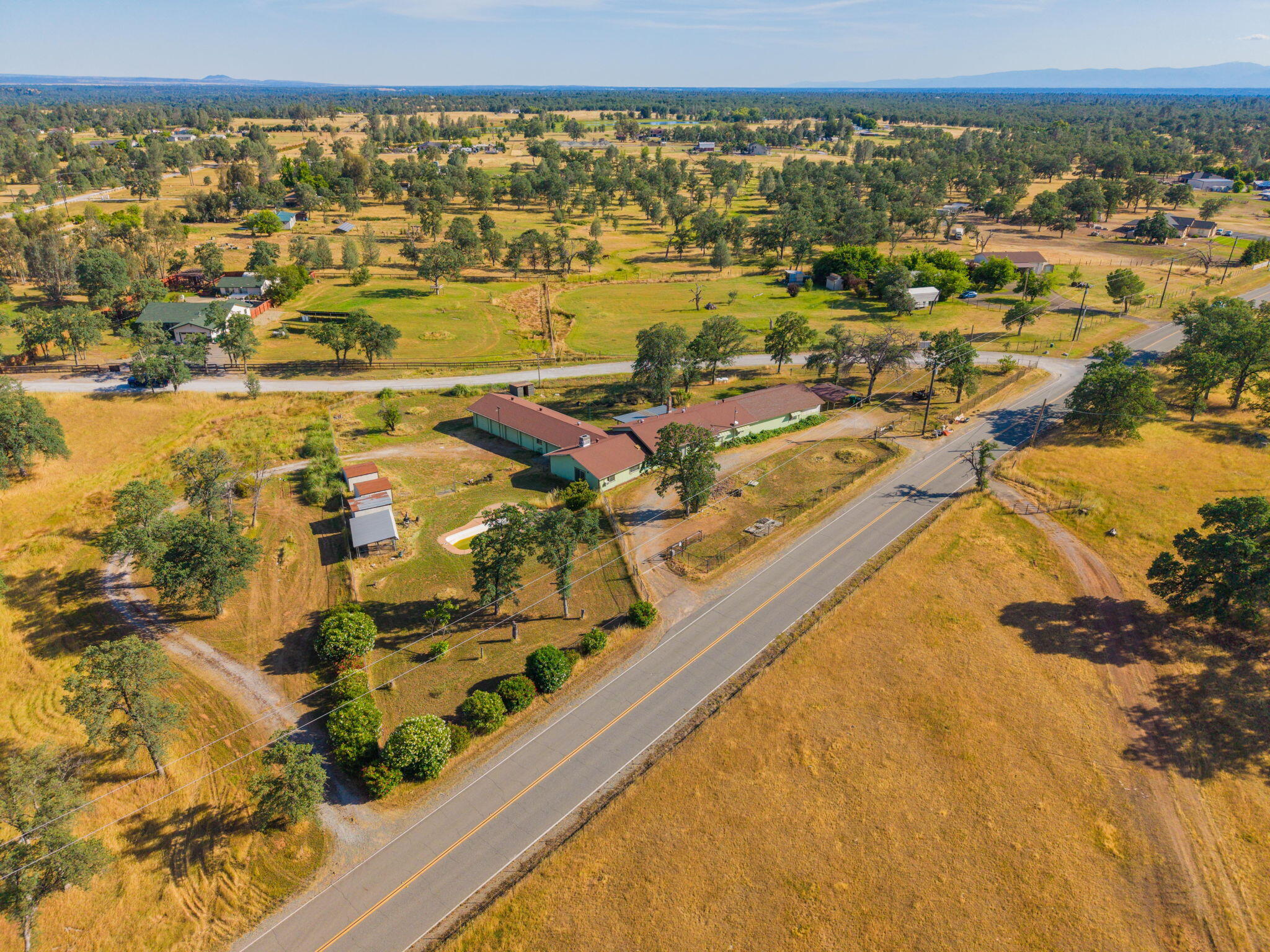 22189 Old Alturas Road Redding, CA 96003 - Photo 57 of 70 an aerial view of residential houses with outdoor space