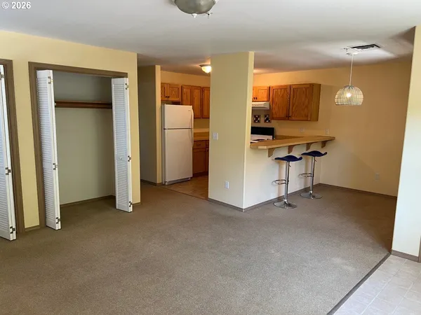a view of an empty room with a bathroom