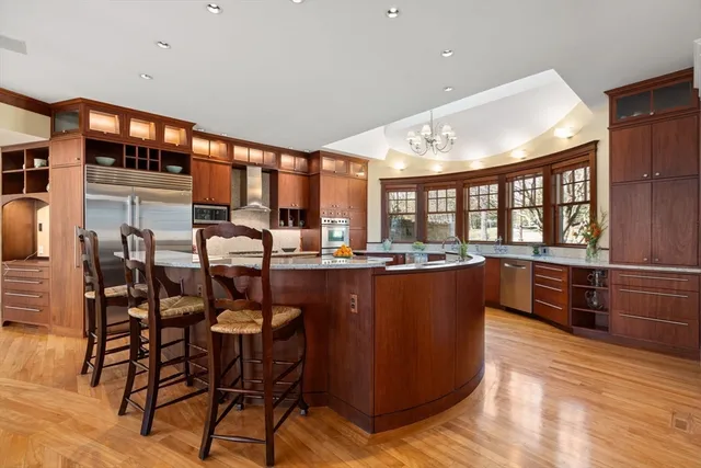 a living room with furniture a counter top space and a ceiling fan