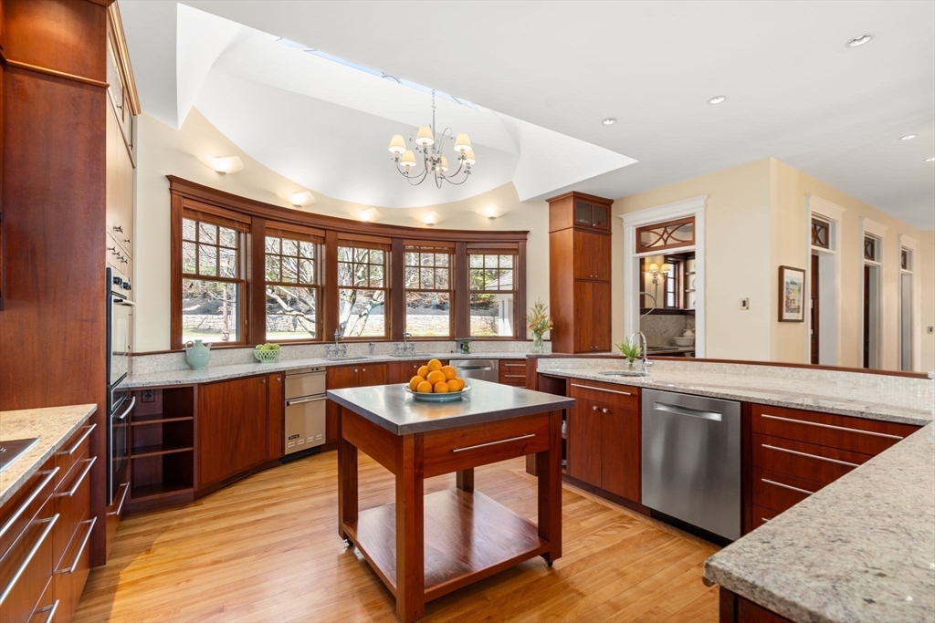 53 Paine Avenue Beverly, MA 01915 - Photo 14 of 40 a large kitchen with stainless steel appliances granite countertop a stove and a sink