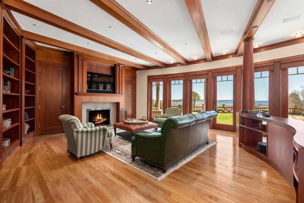 53 Paine Avenue Beverly, MA 01915 - Photo 15 of 40 a living room with furniture and a fireplace