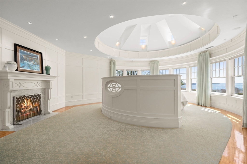 53 Paine Avenue Beverly, MA 01915 - Photo 19 of 40 a view of an empty room with a fireplace