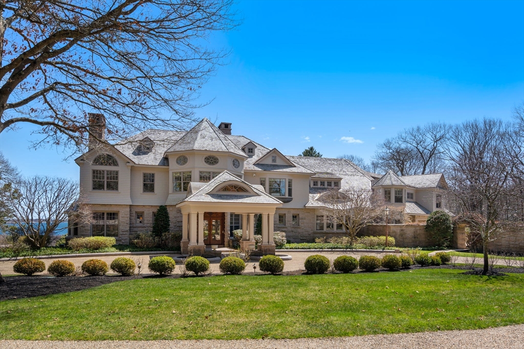 53 Paine Avenue Beverly, MA 01915 - Photo 2 of 40 a front view of a house with a garden and plants