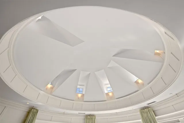 a view of staircase with white walls and utility