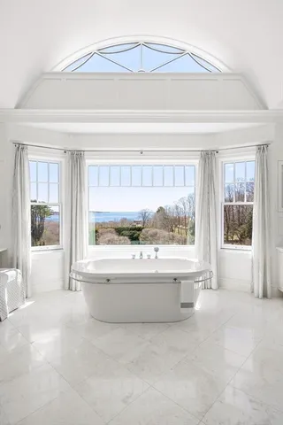 a view of a bathtub and a window