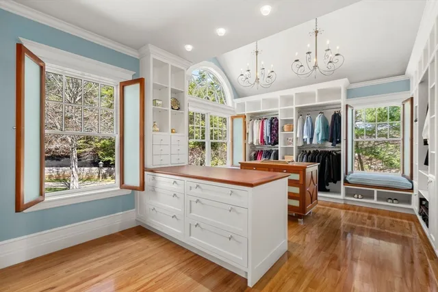 a large kitchen with stainless steel appliances granite countertop a large stove a sink dishwasher and a large oven with wooden floor