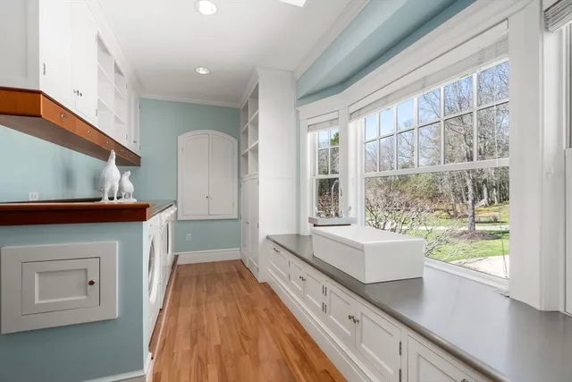 a bathroom with a sink a large mirror and a bathtub
