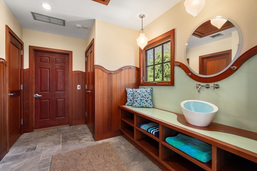 53 Paine Avenue Beverly, MA 01915 - Photo 33 of 40 a bathroom with a sink a mirror and a shower