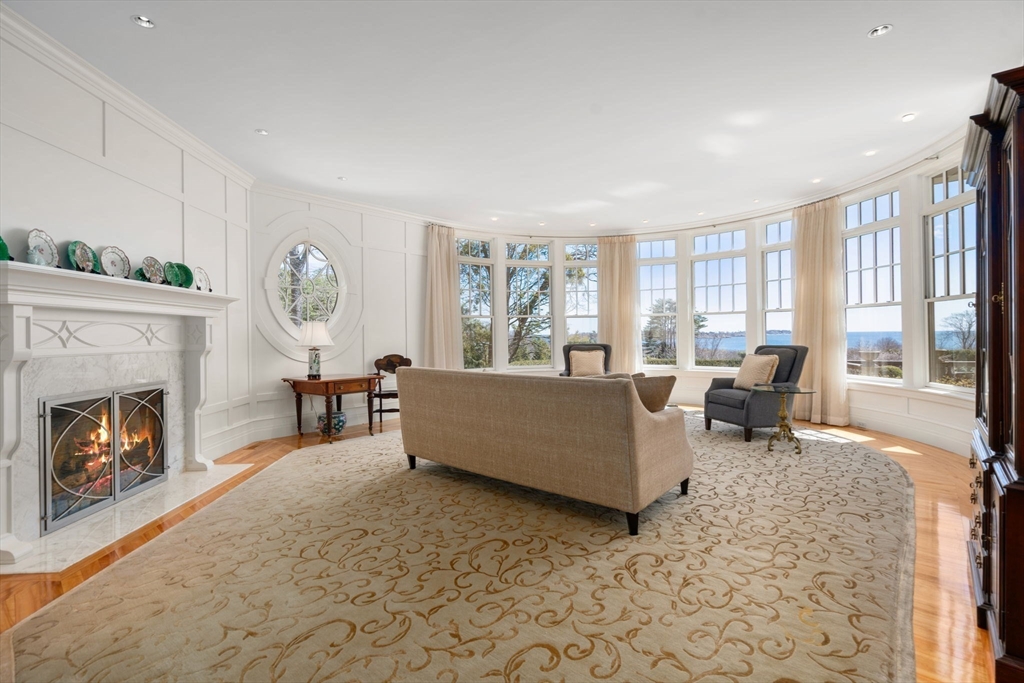 53 Paine Avenue Beverly, MA 01915 - Photo 6 of 40 a living room with furniture and a fireplace