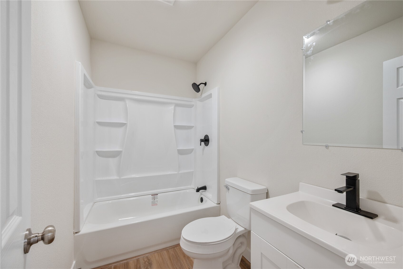 288 21st Avenue Longview, WA 98632 - Photo 15 of 22 a bathroom with a sink a toilet and shower