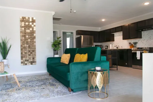 a living room with furniture and a flat screen tv