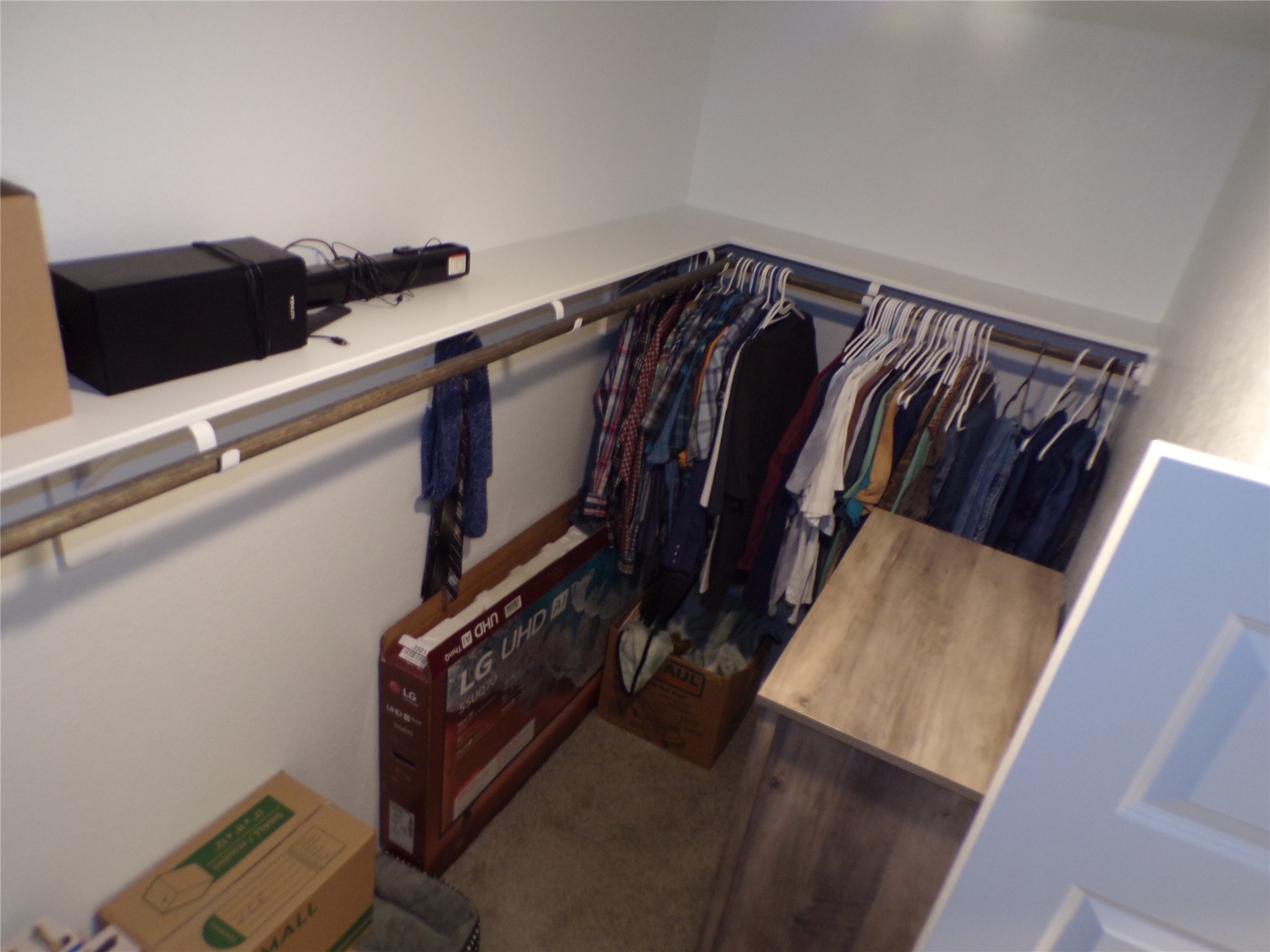 15419 Dapple Blf Lane Conroe, TX 77302 - Photo 11 of 19 a view of walk in closet with clothes and shoes