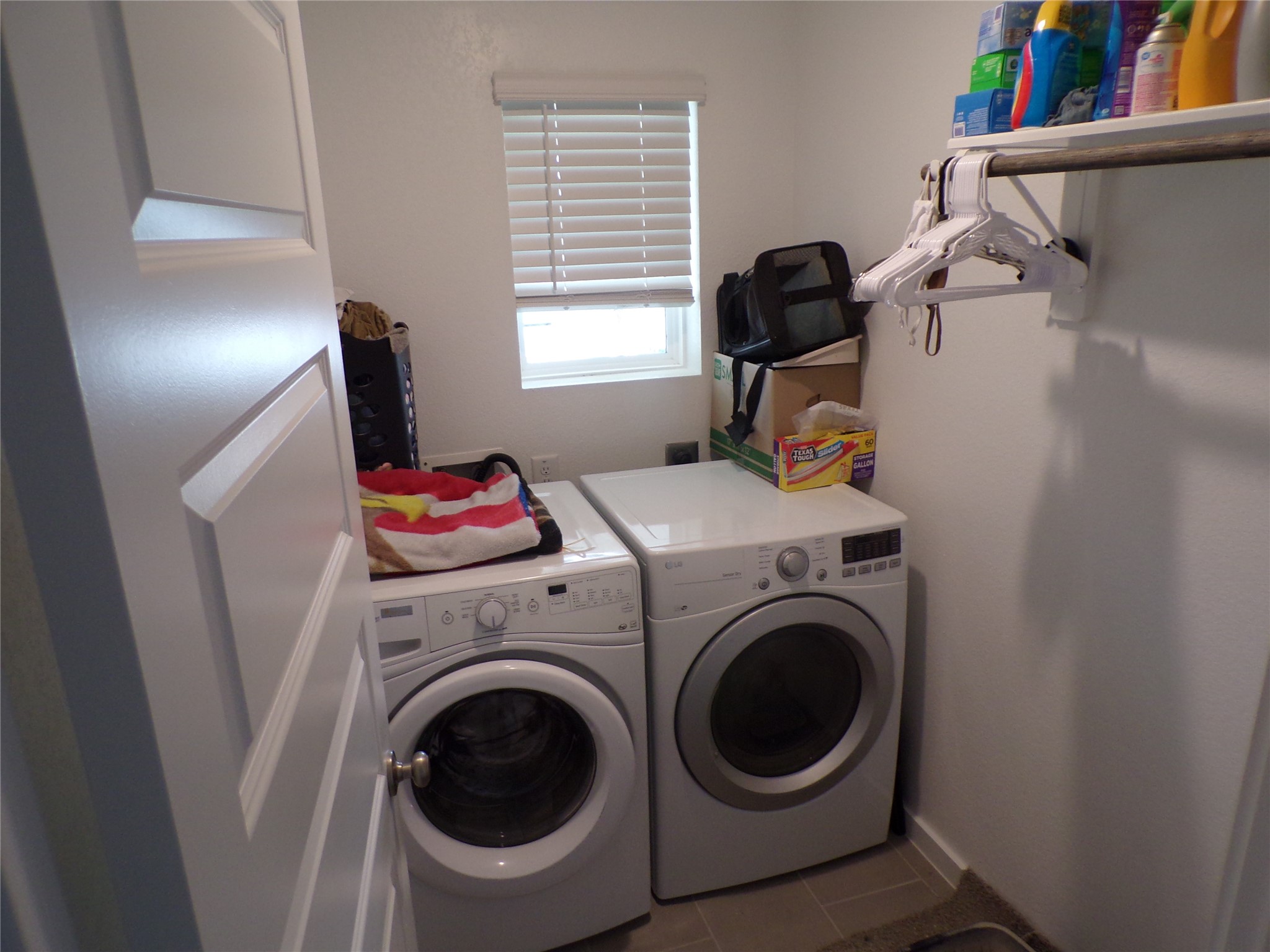15419 Dapple Blf Lane Conroe, TX 77302 - Photo 17 of 19 a utility room with dryer and washer