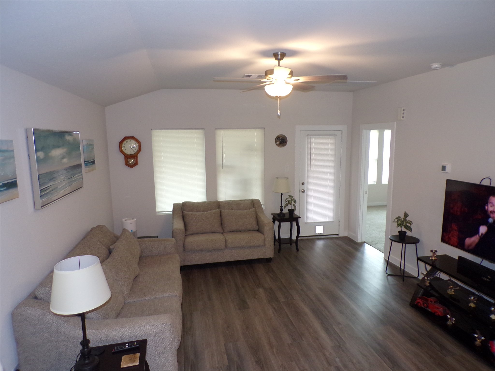 15419 Dapple Blf Lane Conroe, TX 77302 - Photo 5 of 19 a living room with furniture and a flat screen tv