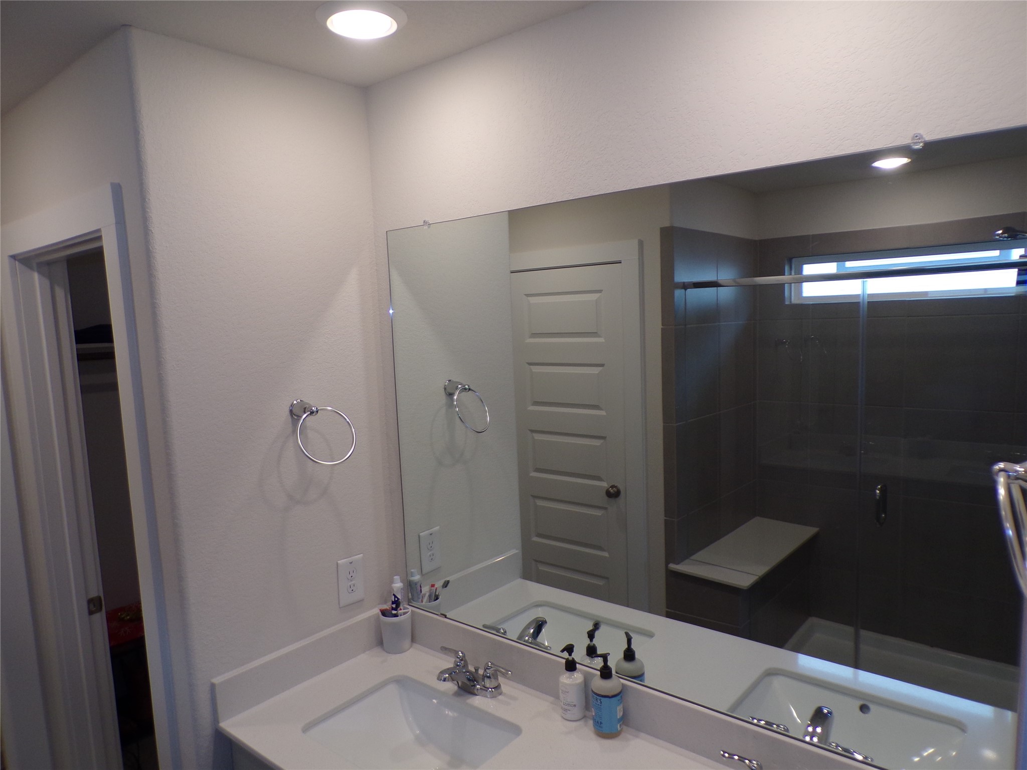 15419 Dapple Blf Lane Conroe, TX 77302 - Photo 8 of 19 a bathroom with a sink and a mirror