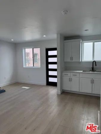 a view of a kitchen with electric appliances