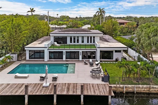 a view of a lake with boats and trees in the background