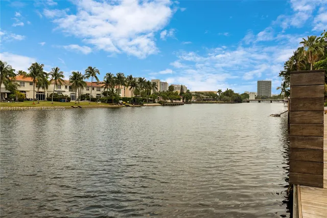 a swimming pool with outdoor seating and yard