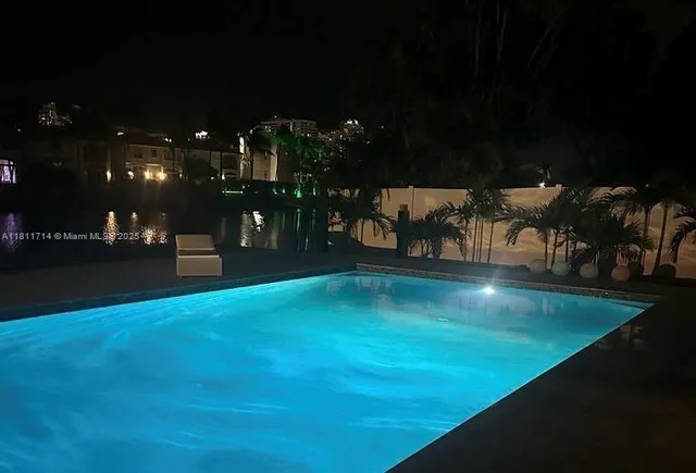 a living room with lots of furniture and wooden floor