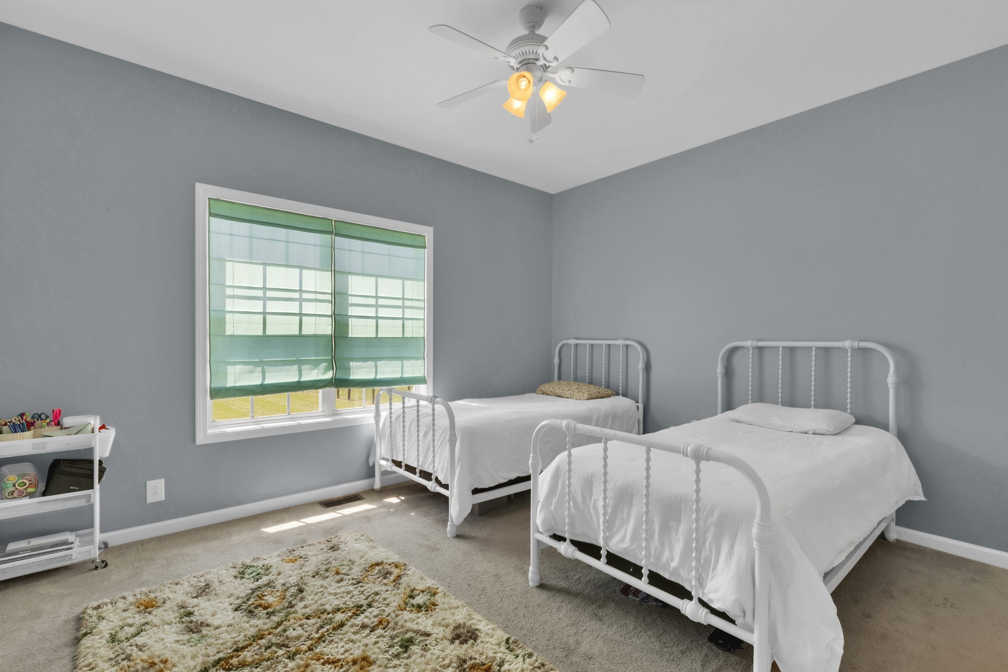 3988 Fykes Grove Road Cedar Hill, TN 37032 - Photo 20 of 50 a spacious bedroom with two beds and a window