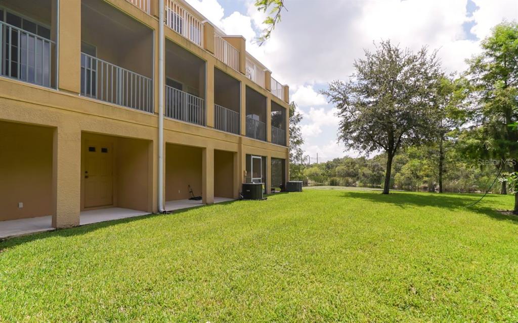 7339 Black Walnut Way Lakewood Ranch, FL 34202 - Photo 23 of 27 a view of an house with backyard space and balcony