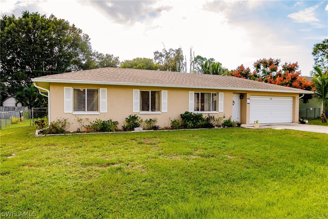 18506 Geranium Road Fort Myers, FL 33967 - Photo 1 of 32 a front view of house with yard and green space