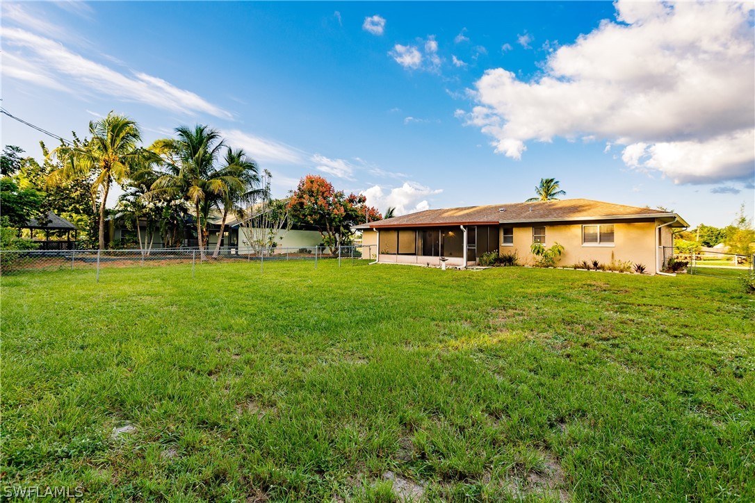 18506 Geranium Road Fort Myers, FL 33967 - Photo 27 of 32 a front view of a house with garden