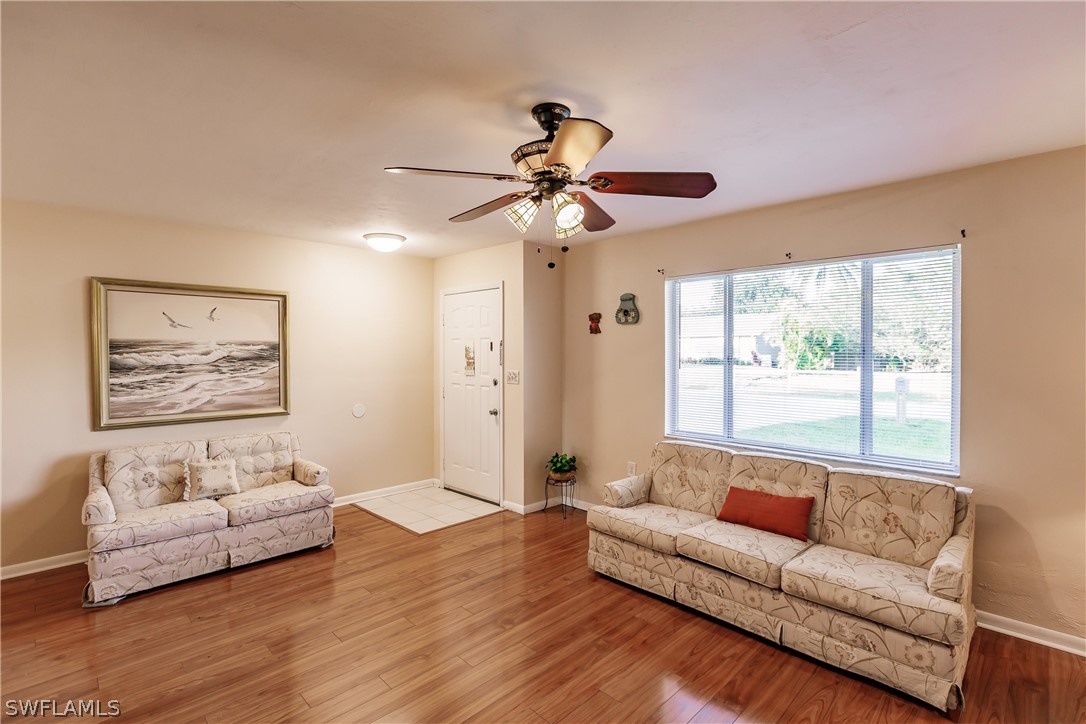 18506 Geranium Road Fort Myers, FL 33967 - Photo 5 of 32 a living room with furniture and a large window