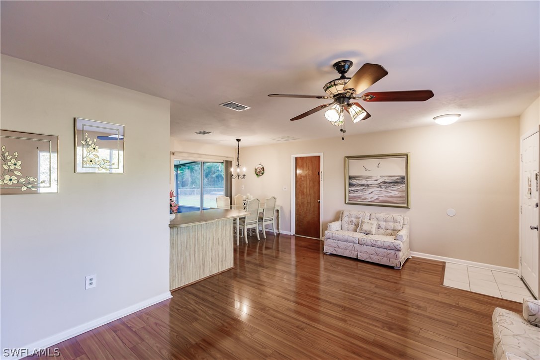 18506 Geranium Road Fort Myers, FL 33967 - Photo 8 of 32 a view of a livingroom with furniture and wooden floor