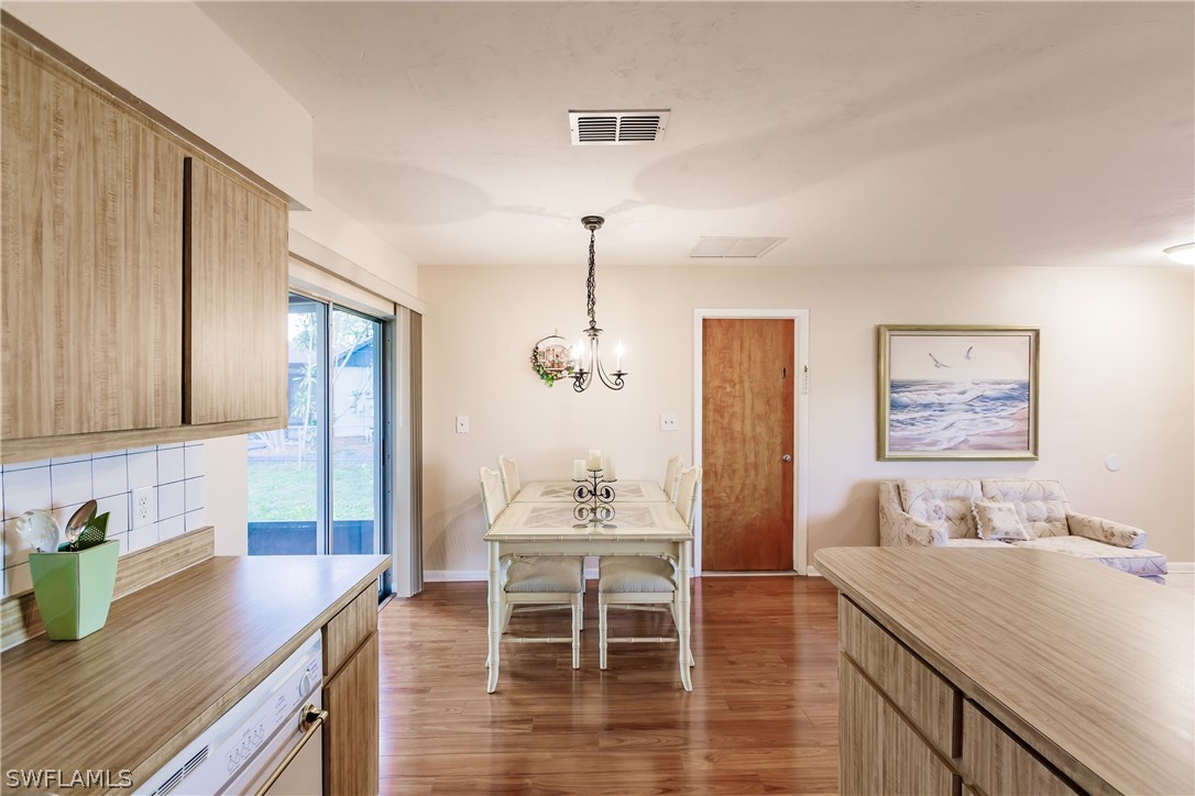 18506 Geranium Road Fort Myers, FL 33967 - Photo 9 of 32 a dining room with furniture and window