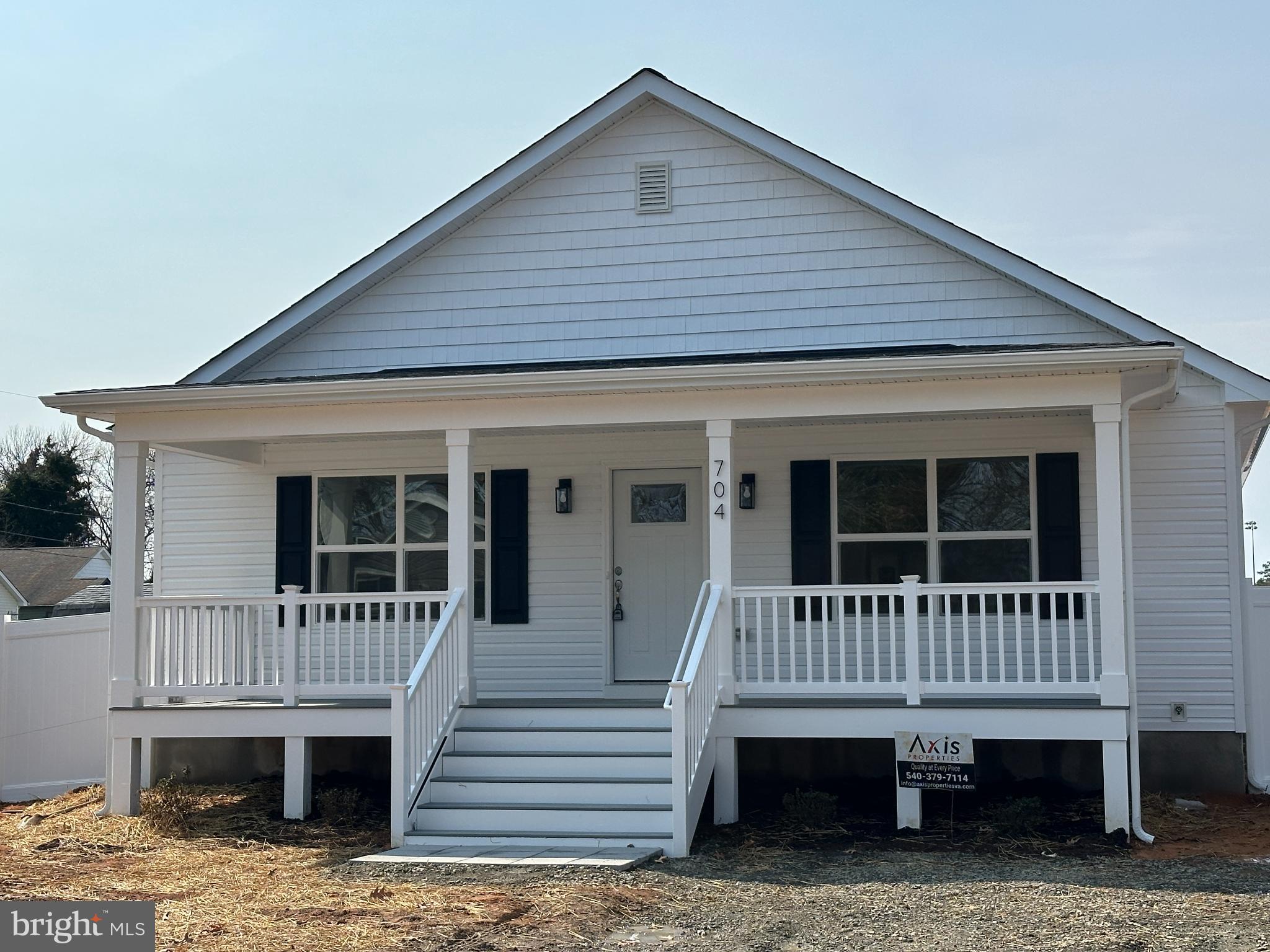 704 Jackson Street Colonial Beach, VA 22443 - Photo 2 of 3 Charming white cottage with inviting porch.