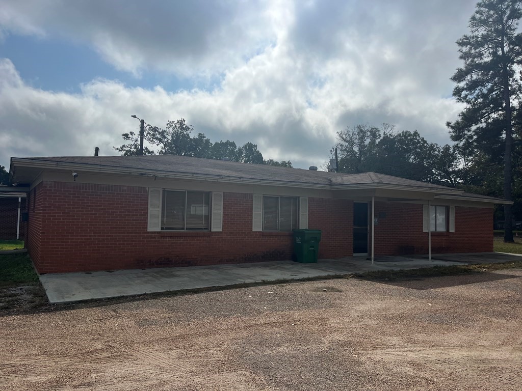 215 Buchanan Street Broaddus, TX 75929 - Photo 13 of 30 a backyard of a house with large trees