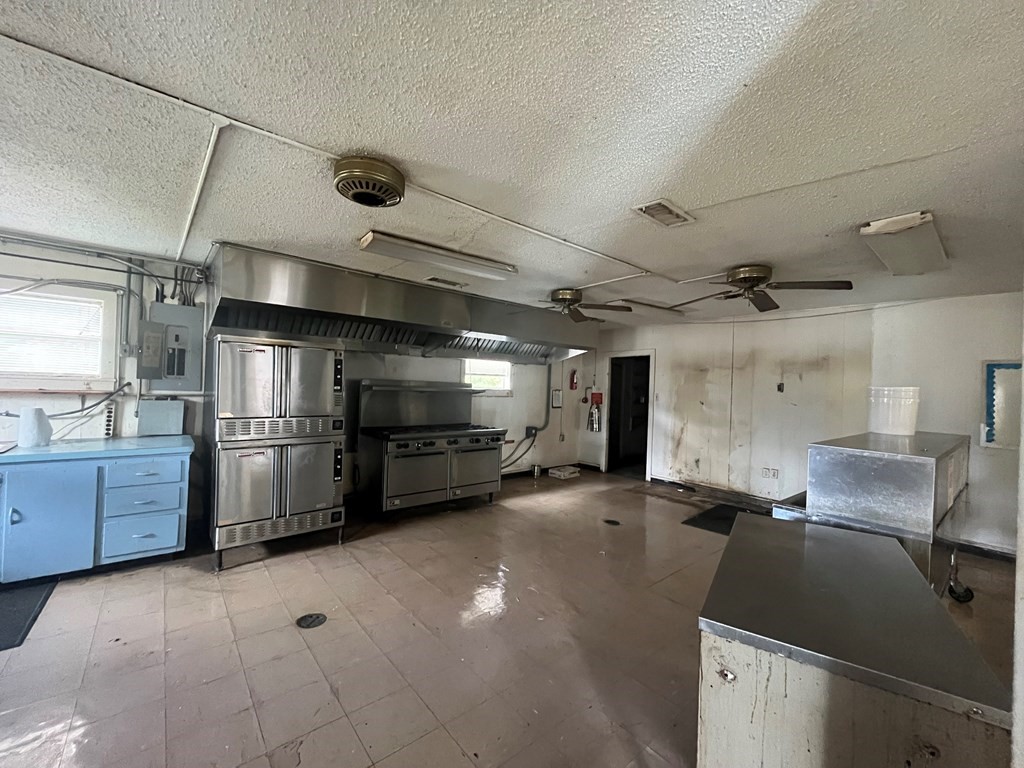 215 Buchanan Street Broaddus, TX 75929 - Photo 16 of 30 a kitchen with refrigerator and stove