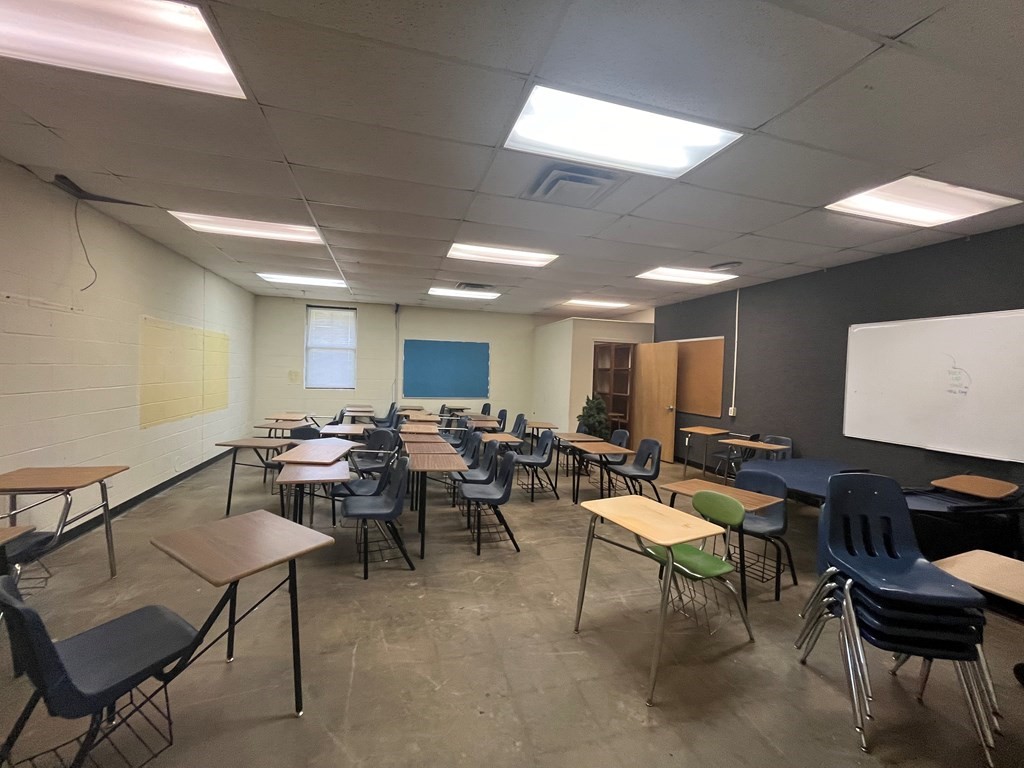 215 Buchanan Street Broaddus, TX 75929 - Photo 18 of 30 a group of people sitting at tables in a room