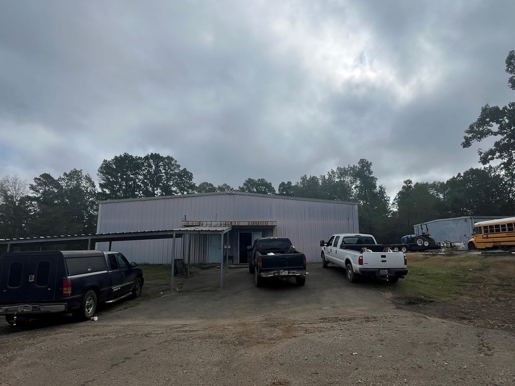 215 Buchanan Street Broaddus, TX 75929 - Photo 25 of 30 a view of a cars park in front of house