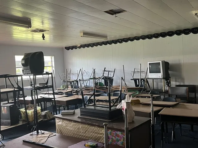 a living room with lots of furniture and painting on the wall