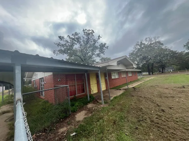 a backyard of a house with lots of green space