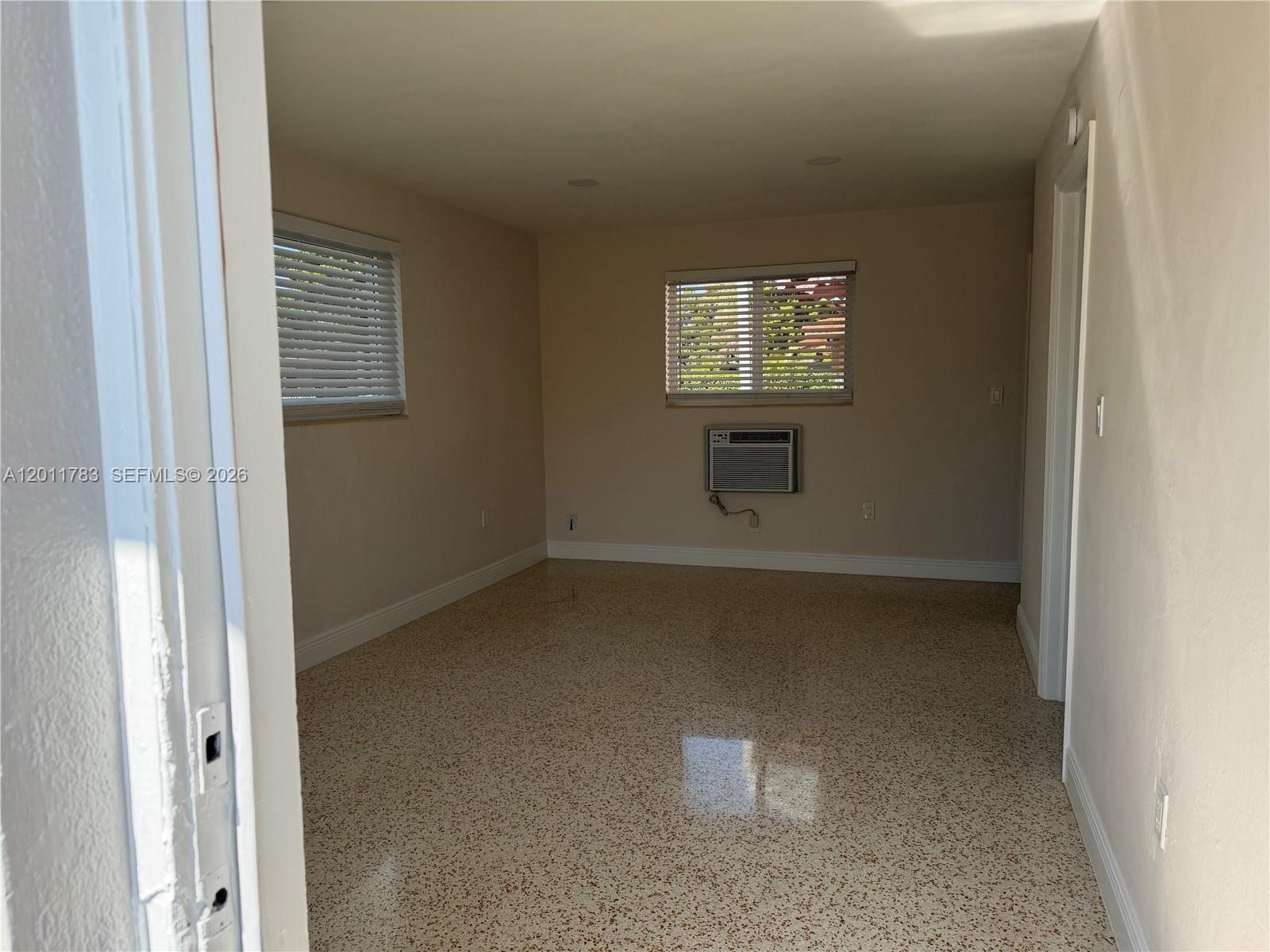 3311 Southwest 25th Terrace, Unit 3315 Miami, FL 33133 - Photo 2 of 10 a view of an empty room with a window