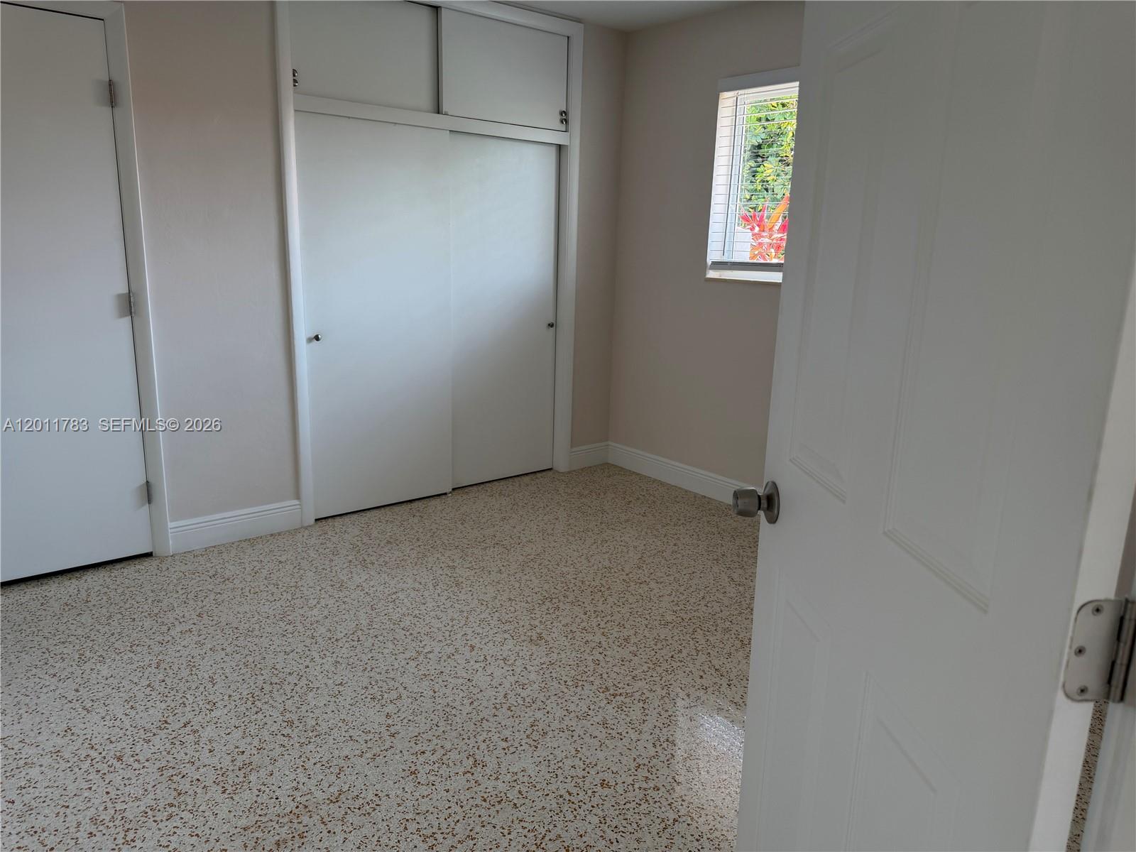 3311 Southwest 25th Terrace, Unit 3315 Miami, FL 33133 - Photo 4 of 10 an empty room with windows