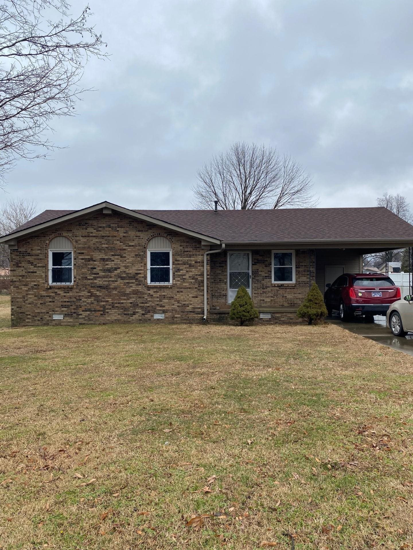 570 Dillard Street Ridgely, TN 38080 - Photo 1 of 10 a front view of a house with parking space