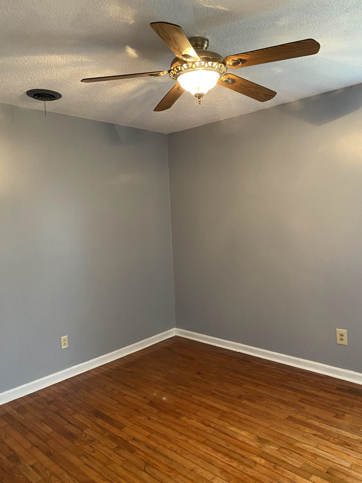 570 Dillard Street Ridgely, TN 38080 - Photo 5 of 10 a view of a room with wooden floor and fan