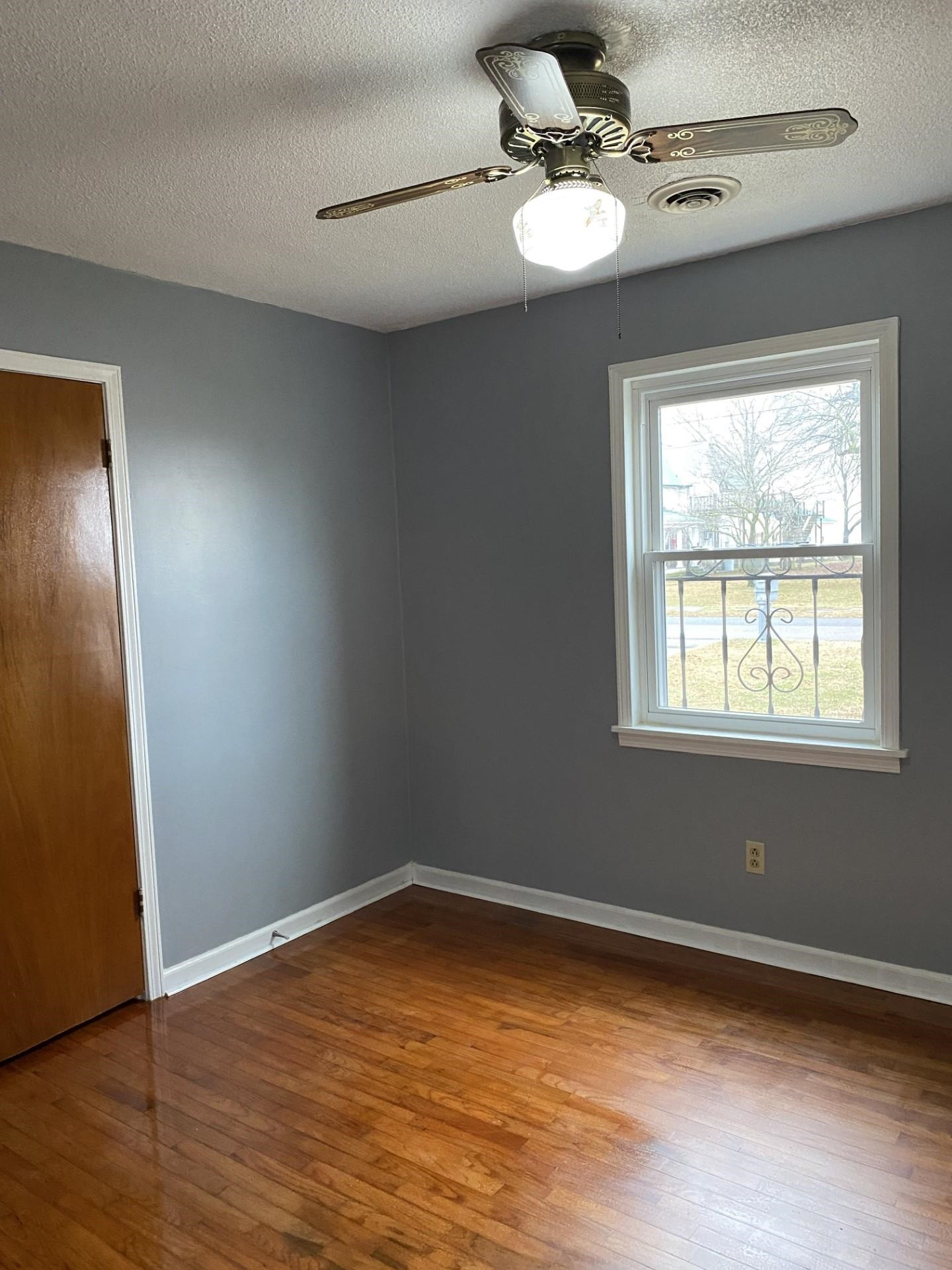 570 Dillard Street Ridgely, TN 38080 - Photo 6 of 10 a view of a room with wooden floor fan and window