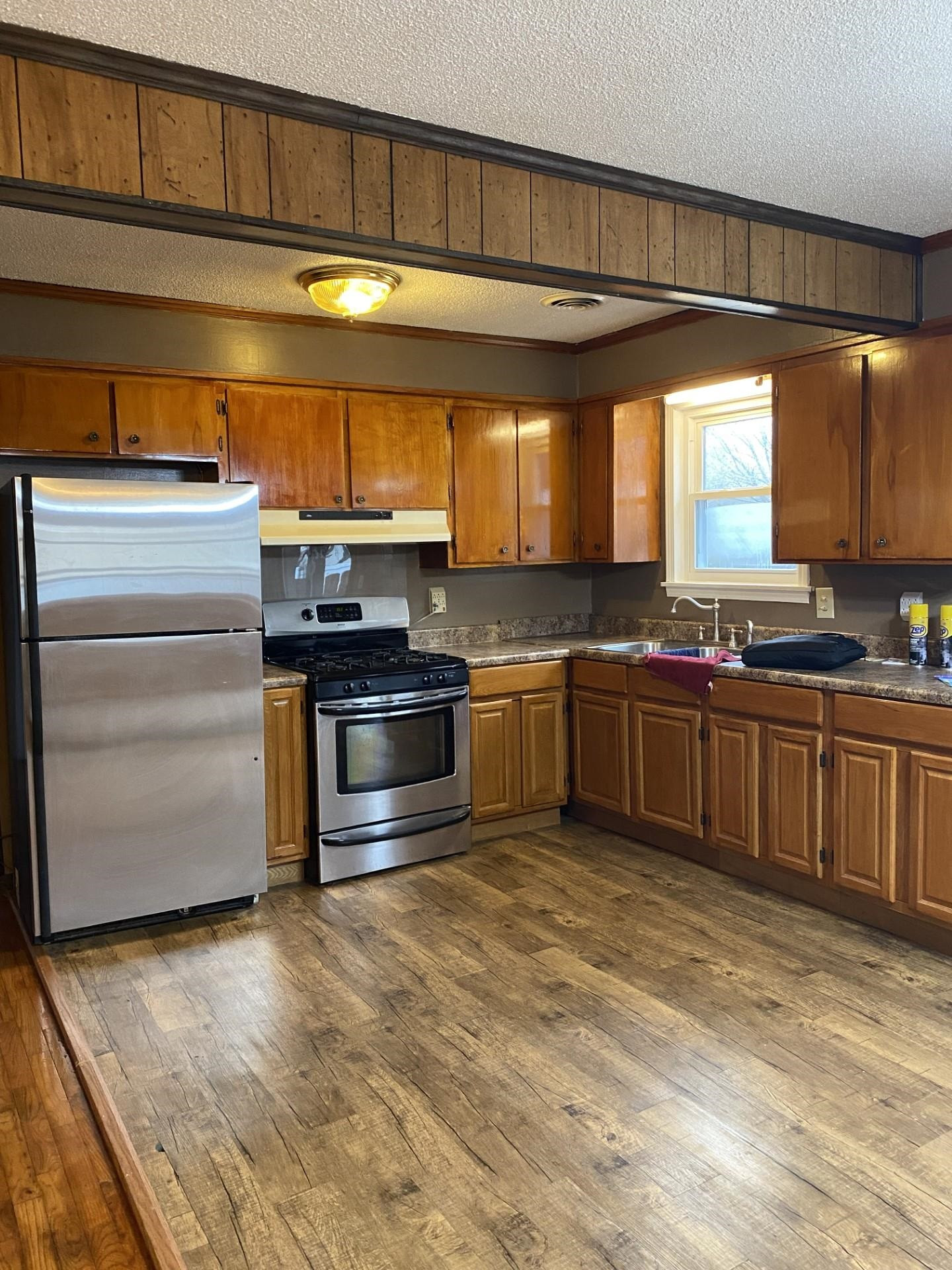 570 Dillard Street Ridgely, TN 38080 - Photo 8 of 10 a kitchen with stainless steel appliances granite countertop a stove a sink and a microwave