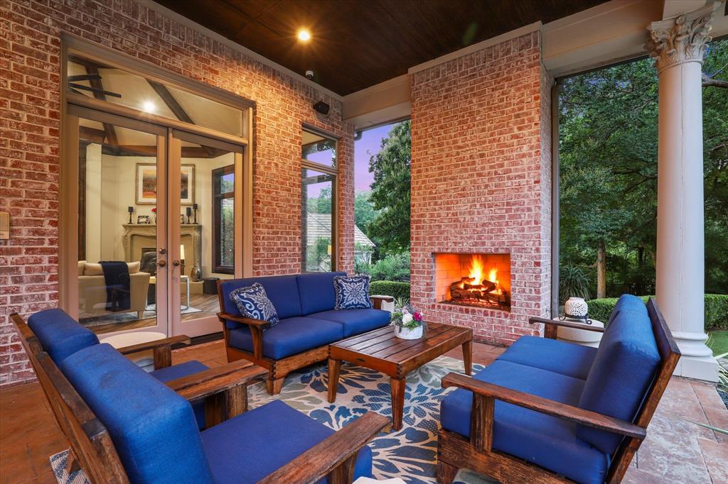 6512 Old Gate Road Plano, TX 75024 - Photo 4 of 40 Enjoy cozy private evenings on your covered patio with fireplace.