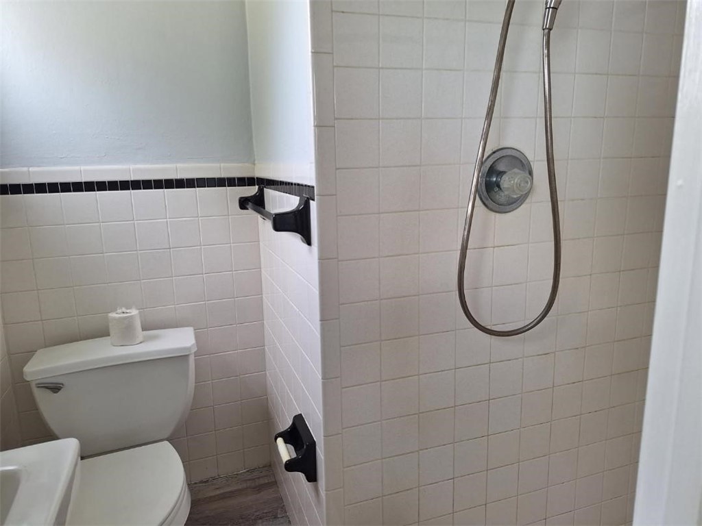 9150 44th Avenue, Unit 15 Sebastian, FL 32958 - Photo 18 of 21 a bathroom with a toilet and a shower