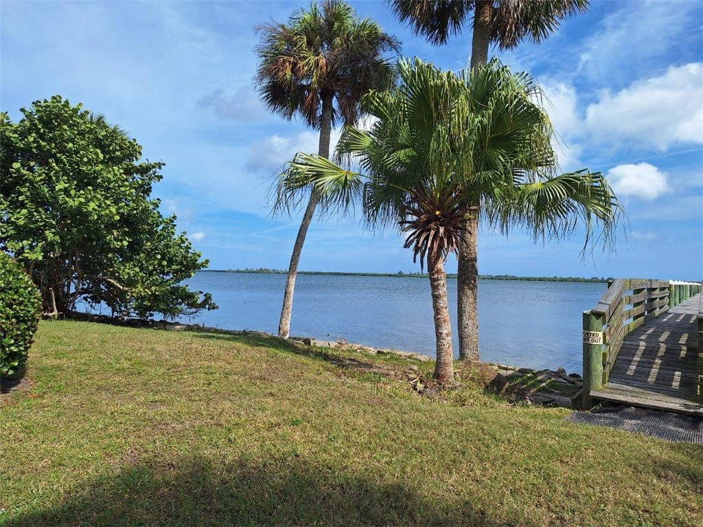 9150 44th Avenue, Unit 15 Sebastian, FL 32958 - Photo 5 of 21 a view of a yard with palm tree