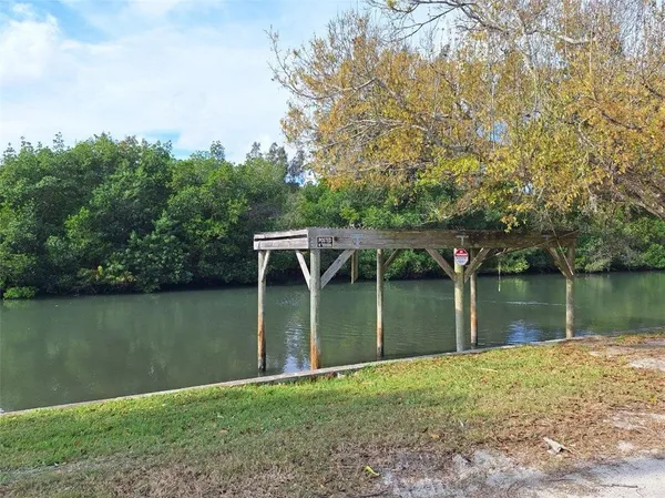 a view of a lake with a house in the background
