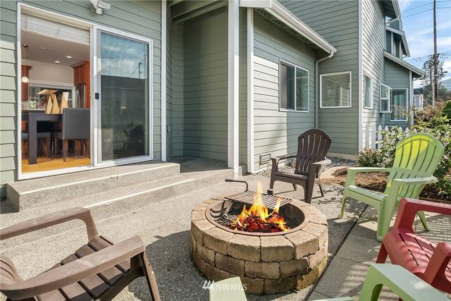a backyard of a house with outdoor seating