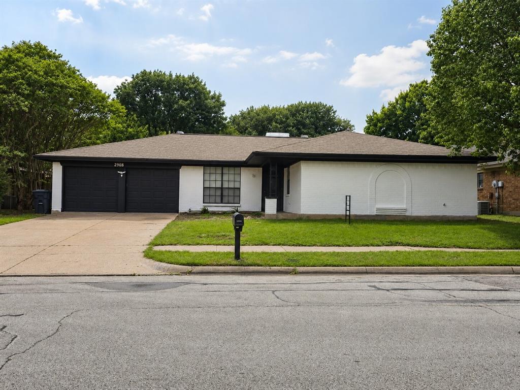 2908 Legend Road Arlington, TX 76014 - Photo 2 of 29 Freshly updated with a crisp white exterior and bold black accents, this beautifully refreshed home delivers clean modern style with standout curb appeal!